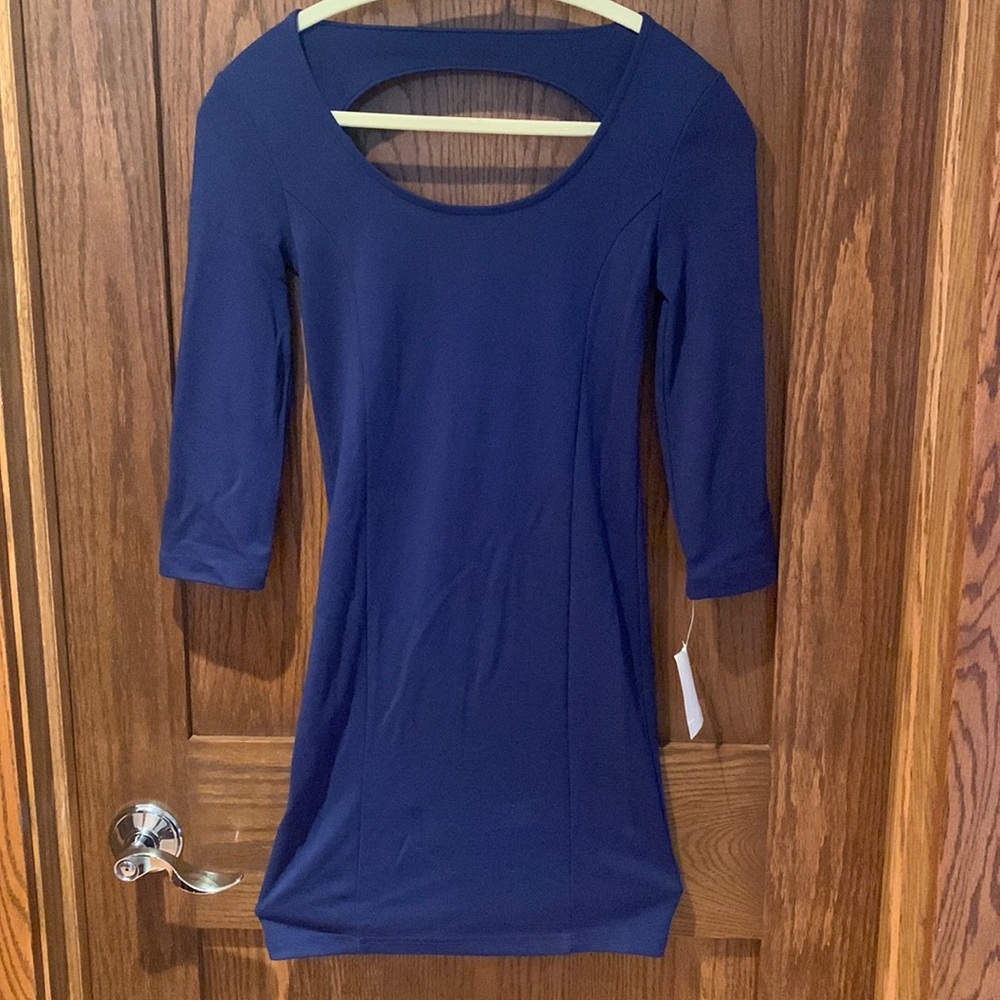 Navy Blue bodycon mini dress. Size Small, 3/4 sleeve. Peek-a-boo cutout. New